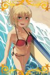  1girl beach blonde_hair breasts cleavage fang fate/grand_order fate_(series) front-tie_bikini front-tie_top looking_at_viewer medium_breasts navel ocean saber_of_red shirairye side-tie_bottom solo surf surfboard wading water 