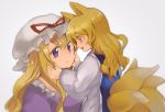  2girls animal_ears bangs blurry blush dress eye_contact fox_ears fox_tail hands_on_another&#039;s_face hat hat_ribbon long_hair long_sleeves looking_at_another mob_cap mother_and_daughter multiple_girls multiple_tails open_mouth purple_dress ribbon shiny shiny_hair shukinuko sidelocks smile tabard tail touhou violet_eyes white_dress yakumo_ran yakumo_yukari yellow_eyes younger 