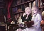  2girls black_dress black_ribbon blonde_hair blue_eyes book bookshelf breasts cake cleavage closed_mouth collarbone couch curtains dress elf food frilled_sleeves frills fruit haori_iori head_tilt holding holding_book inkwell long_hair long_sleeves looking_at_another medium_breasts multiple_girls neck_ribbon open_book original phone pointy_ears quill ribbon short_hair_with_long_locks sitting strawberry white_dress 