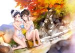  2girls autumn_leaves barefoot bath_stool black_eyes black_hair blush breasts brown_eyes brown_hair cleavage collarbone covering covering_breasts day dutch_angle fukahire_sanba groin hair_up highres holding kneeling looking_at_viewer medium_breasts multiple_girls naked_towel nude nude_cover one_eye_closed original outdoors parted_lips ponytail rock sitting stool towel washing_back wet 