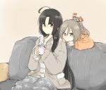  2girls ahoge black_hair blanket brown_background brown_eyes brown_hair casual commentary_request couch cup hibari_(horse809cat) highres jacket kantai_collection long_hair long_sleeves mug multiple_girls ponytail shouhou_(kantai_collection) sitting very_long_hair zuihou_(kantai_collection) 
