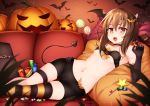  1girl bat_hair_ornament bat_wings bike_shorts brown_eyes brown_hair candy couch elbow_gloves fang gloves hair_ornament halloween healther kantai_collection lollipop navel open_mouth pumpkin short_hair solo strapless striped striped_legwear taihou_(kantai_collection) tubetop wings 