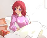  1girl bed bed_sheet box christmas commentary gift gift_box head_rest long_sleeves love_live! messy_hair mii_(nano0o0) nishikino_maki pajamas pillow redhead solo tagme under_covers violet_eyes 