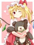  1girl blonde_hair crystal daze_(879530281) dress flandre_scarlet hat hat_ribbon heart highres mob_cap one_eye_closed red_eyes ribbon side_ponytail smile solo stuffed_animal stuffed_toy teddy_bear touhou wings 