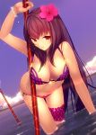  1girl bra bracelet breasts cleavage clouds commentary_request dutch_angle fate/grand_order fate_(series) flower hair_flower hair_ornament hibiscus highres jewelry leaning_forward long_hair looking_at_viewer navel polearm red_eyes scathach_(fate/grand_order) scathach_(swimsuit_assassin)_(fate) smile solo tetsu_(countryside) underwear wading weapon wet 