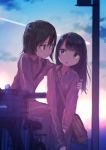  2girls arm_around_shoulder backlighting bag bicycle black_eyes black_hair blurry clouds condensation_trail eye_contact ground_vehicle highres inami_hatoko long_hair looking_at_another multiple_girls open_mouth original school_bag short_hair sitting sky smile telephone_pole track_suit yuri 