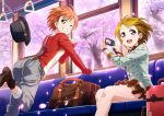  2girls ass bag blush boots breasts brown_hair camera cherry_blossoms earrings green_eyes grin hat hat_removed hoshizora_rin jewelry koizumi_hanayo leaning leaning_forward looking_at_viewer love_live! love_live!_school_idol_festival love_live!_school_idol_project multiple_girls official_art one_eye_closed open_mouth orange_hair pose short_hair skirt smile solo suspenders v violet_eyes watch wink 