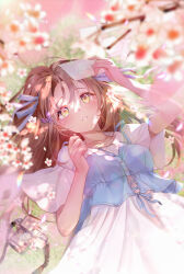  1girl arm_up blue_vest blurry blurry_foreground breasts brown_hair camera cherry_blossoms collarbone collared_dress dappled_sunlight day dress falling_flower falling_petals from_above hair_ribbon hands_up holding holding_letter letter long_hair looking_at_object lying maronie. medium_breasts on_back on_grass original outdoors parted_lips petals ribbon short_sleeves solo sunlight vest white_dress white_ribbon yellow_eyes 