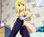  1girl bare_shoulders bathroom black_legwear blonde_hair blush breasts brown_eyes cleavage fairy_tail female indoors large_breasts legs_crossed long_hair lucy_heartfilia sitting smile solo thigh-highs thighhighs_pull undressing 