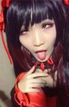 ahegao asian cosplay kurumi_tokisaki photo red_eye tongue tongue_out yellow_eye