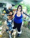  2girls arm_around_shoulder armor bikini_top boots breasts brown_hair cleavage cosplay fur_trim gas_mask genderswap genderswap_(mtf) glasses hair_ornament hook huge_breasts knee_pads large_breasts mei_(overwatch) midriff multiple_girls overwatch photo plump ponytail roadhog_(overwatch) shoulder_pads tank_top tattoo white_hair wide_hips yellow_eyes 