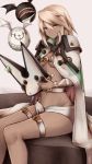  1girl beltbra blonde_hair blush breasts cape cleavage dark_skin groin guilty_gear guilty_gear_xrd hat hat_removed headwear_removed highres holding holding_hat inaba_sunimi long_hair looking_at_viewer navel ramlethal_valentine short_shorts shorts sitting small_breasts solo thigh_strap under_boob white_cape yellow_eyes 