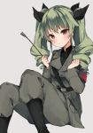 1girl anchovy armband belt boots breasts brown_eyes clenched_teeth drill_hair girls_und_panzer green_hair grey_background hair_ribbon highres holding jacket knee_boots knees_up long_hair looking_at_viewer medium_breasts military military_uniform pants pimemomo ribbon riding_crop simple_background sitting solo teeth twin_drills twintails uniform 