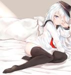  1girl anchor arm_support bangs bed bed_sheet black_legwear blue_eyes blush chestnut_mouth cushion flat_cap full_body hair_between_eyes hat hibiki_(kantai_collection) highres kantai_collection long_hair looking_at_viewer lying neckerchief no_panties one_eye_closed open_mouth school_uniform see-through serafuku silver_(chenwen) silver_hair sitting soles solo thigh-highs thighs yokozuwari 