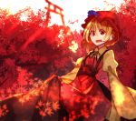  1girl aki_minoriko autumn_leaves backlighting black_ribbon blonde_hair cliff dress food fruit grapes hat juliet_sleeves leaf long_sleeves looking_at_viewer maple_leaf mob_cap neck_ribbon open_mouth peach_camellia puffy_sleeves red_eyes ribbon sash scenery short_hair solo torii touhou tree wide_sleeves 