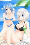  2girls beach beach_chair bikini black_bikini blue_bikini blue_eyes blue_hair breasts double_bun eyes_visible_through_hair hair_ornament hair_over_one_eye hairclip hamakaze_(kantai_collection) hat highres kantai_collection large_breasts leaning_forward looking_at_viewer multiple_girls navel ocean one_eye_closed open_mouth palm_tree sakikumo_(sakumo) silver_hair sky swimsuit table tree urakaze_(kantai_collection) v 