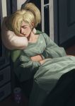  1girl absurdres blonde_hair can closed_eyes closed_mouth collarbone commentary crossed_arms emblem hair_ornament hair_over_one_eye hair_tie head_tilt highres leaning_back lips lipstick makeup mercy_(overwatch) overwatch pillow ponytail red_lips red_lipstick shirt sitting sleeping solo tony_sun 