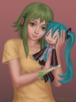  1girl character_doll gohpot green_eyes green_hair gumi hatsune_miku headphones highres holding signature smile solo spring_onion upper_body vocaloid watermark web_address 