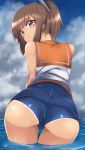  1girl ass blue_sky blurry brown_eyes brown_hair clouds cloudy_sky commentary_request depth_of_field from_behind highres i-401_(kantai_collection) kantai_collection leaning_forward looking_at_viewer looking_back mku ocean partially_submerged ponytail school_swimsuit school_uniform serafuku sky smile solo swimsuit swimsuit_under_clothes tan wet wet_clothes 