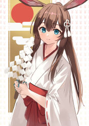  1girl absurdres alternate_costume amiya_(arknights) animal_ears arknights blue_eyes brown_hair closed_mouth commentary_request egasumi gohei hair_between_eyes hair_ornament highres hino134 holding holding_gohei japanese_clothes jewelry kimono light_blush long_hair looking_at_viewer miko multiple_rings partial_commentary red_sun ring shide smile solo split_mouth tassel tassel_hair_ornament white_kimono wide_sleeves 