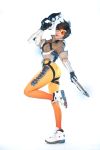  1girl asian bodysuit cosplay gun overwatch photo solo tasha_(cosplayer) tracer_(overwatch) tracer_(overwatch)_(cosplay) weapon 