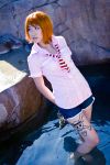  1girl arms_behind_back bangs collared_shirt cosplay female holding joluffirosauce looking_to_the_side nami_(cosplay) nami_(one_piece) no_shoes one_piece photo pink_shirt shirt shoes shoes_removed short_hair short_sleeves shorts solo toes wading water 