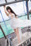  1girl asian black_hair breasts dress hair_ornament highres large_breasts ocean photo water white_dress zhu_ker_er(barbie) 