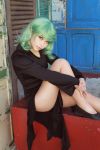  1girl black_dress cosplay dress green_eyes green_hair legs one-punch_man photo sitting solo tatsumaki tatsumaki_(cosplay) 