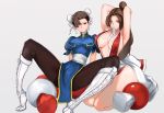  2girls adjusting_hair armpits arms_behind_head arms_up boots breast_envy breasts brown_eyes brown_hair bun_cover chinese_clothes chun-li cleavage crossover curvy double_bun fatal_fury japanese_clothes king_of_fighters kndy kneeling large_breasts long_hair looking_at_viewer multiple_girls pelvic_curtain puffy_sleeves shiranui_mai short_hair sitting smile spread_legs street_fighter thick_thighs wide_hips 