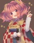  1girl apron bell blush book brown_background character_name checkered hair_bell hair_ornament head_tilt highres long_sleeves looking_at_viewer motoori_kosuzu open_mouth red_eyes redhead skirt smile solo touhou twintails upper_body usamata vest wide_sleeves 