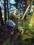  armor belt blonde_hair blue_eyes boots chainmail cosplay forest hat likovacs link nature outdoors photo pointy_ears shield solo standing sword the_legend_of_zelda the_legend_of_zelda:_twilight_princess tree 