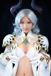 1girl breasts castanic_(tera) cosplay female looking_at_viewer photo silver_hair simple_background solo tera_online 