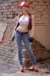  1girl blonde_hair cosplay denim fatal_fury fingerless_gloves genderswap gloves hat high_heels jeans midriff navel non-asian pants photo ponytail snk solo tank_top terry_bogard terry_bogard_(cosplay) torn_jeans vest 