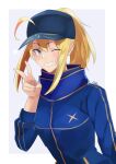  1girl absurdres ahoge artoria_pendragon_(fate) aya_roushi bangs blonde_hair breasts coat fate/grand_order fate_(series) green_eyes hat highres long_hair looking_at_viewer mysterious_heroine_x_(fate) one_eye_closed open_mouth peaked_cap ponytail simple_background smile solo teeth upper_body victory_pose white_background 