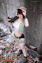  1girl breasts brown_hair cleavage cosplay fio_germi glasses gun hat metal_slug midriff photo shorts snk solo weapon 