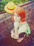  1girl camisole cosplay hat nami_(one_piece) nami_(one_piece)_(cosplay) one_piece orange_hair photo sandals short_hair shorts solo straw_hat 