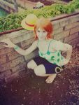  1girl camisole cosplay hat nami_(one_piece) nami_(one_piece)_(cosplay) one_piece orange_hair photo sandals short_hair shorts solo straw_hat 
