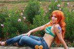  1girl bikini bikini_top bodypaint cosplay denim flower jeans nami_(one_piece) nami_(one_piece)_(cosplay) one_piece orange_hair pants photo solo swimsuit 