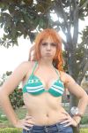  1girl bikini breasts cosplay nami_(one_piece) nami_(one_piece)_(cosplay) one_piece orange_hair photo solo swimsuit 