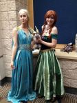  2girls a_song_of_ice_and_fire anna_(frozen) blue_dress braid carrie_marie cosplay daenerys_targaryen disney dress frozen_(disney) game_of_thrones green_dress jewelry multiple_girls necklace photo smile standing story stuffed_toy urulokid 