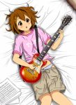 1girl :o beamed_quavers bed brown_eyes brown_hair casual clothes_writing diesel-turbo gibson_les_paul guitar hirasawa_yui instrument k-on! lying musical_note panties quaver sheet_music short_hair solo striped striped_panties underwear 