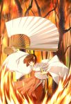  1girl brown_eyes brown_hair dual_wielding fan fire folding_fan japanese_clothes kaze_no_stigma miko ogami_misao oversized_object red_hakama short_hair solo tree 