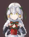  1girl bell bikini black_bikini black_gloves blonde_hair bow box breasts capelet christmas cleavage elbow_gloves fate/grand_order fate_(series) gift gift_box gloves hair_ribbon helmet jeanne_alter jeanne_alter_(santa_lily)_(fate) ribbon ruler_(fate/apocrypha) santa_costume silver_(chenwen) solo swimsuit yellow_eyes 