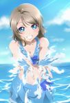  1girl absurdres bare_shoulders blue_eyes breasts brown_hair cleavage grin highres looking_at_viewer love_live! love_live!_sunshine!! midriff navel ocean ribbon sarong short_hair smile solo splashing surfing_orange swimsuit watanabe_you water wet 