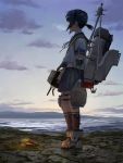  1girl absurdres amputee anchor anchor_symbol black_hair bonfire boots clouds commentary damaged from_side fubuki_(kantai_collection) full_body highres holding holding_weapon horizon kantai_collection kneehighs looking_to_the_side machinery mechanical_arm morning ocean outdoors pleated_skirt scenery school_uniform serafuku shirt short_hair short_ponytail short_sleeves sidelocks skirt sky solo standing tomiya_(tomiya2117) torn_clothes torn_shirt turret water weapon wind 