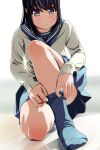  1girl black_eyes black_hair blue_legwear blurry blush depth_of_field feet highres kneeling long_sleeves matsunaga_kouyou no_shoes original reflection school_uniform serafuku short_hair skirt sock_pull socks solo white_background 