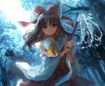  1girl ascot bow brown_eyes brown_hair detached_sleeves forest gohei hair_bow hair_tubes hakurei_reimu holding japanese_clothes long_hair long_sleeves looking_at_viewer miko nature outdoors red_bow red_skirt ribbon-trimmed_sleeves ribbon_trim skirt skirt_set smile solo sunlight touhou tree tyokopai911 wide_sleeves yellow_ascot 