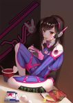 1girl against_wall bag bangs between_legs bodysuit boots breasts brown_eyes brown_hair bucket bunny_print character_name chips chopsticks covered_navel d.va_(overwatch) eating facepaint facial_mark food food_in_mouth full_body hand_between_legs handheld_game_console headphones high_collar indoors long_hair medium_breasts o-yatsu overwatch pilot_suit playing_games ribbed_bodysuit shoulder_pads sitting skin_tight solo swept_bangs whisker_markings white_boots 