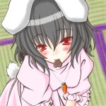  1girl animal_ears black_hair blush bunny_tail carrot chocolate chocolate_heart female heart inaba_tewi looking_at_viewer mouth_hold rabbit_ears red_eyes short_hair solo tail tatami touhou 