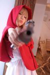  1girl aiming_at_viewer bulleta capcom cosplay desert_eagle gun handgun holding holding_gun holding_weapon hood photo pistol solo vampire_(game) weapon 